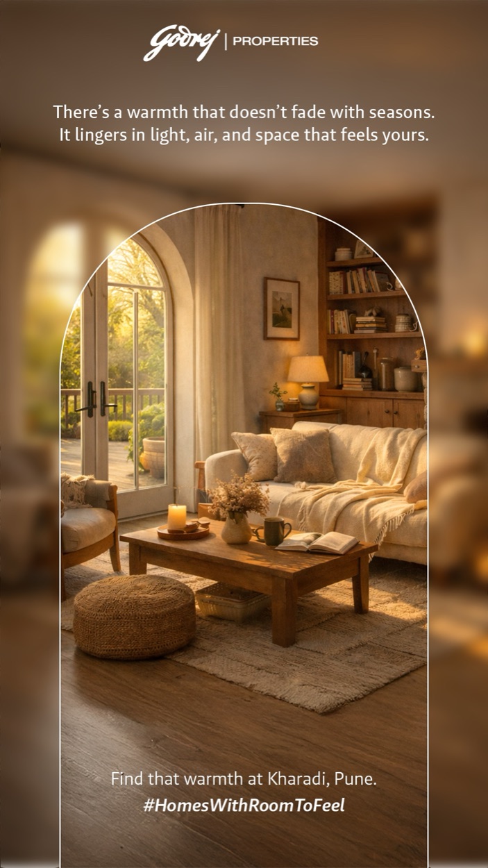 Story frame: a warm living room of bookshelves and soft seating, framed in an arch — “Find that warmth at Kharadi, Pune.”