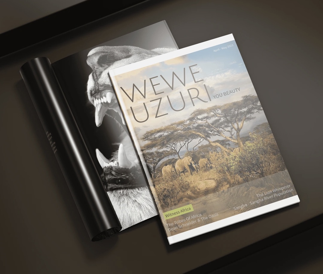 The WEWE UZURI cover — elephants under acacia trees — resting on an open black-and-white spread.